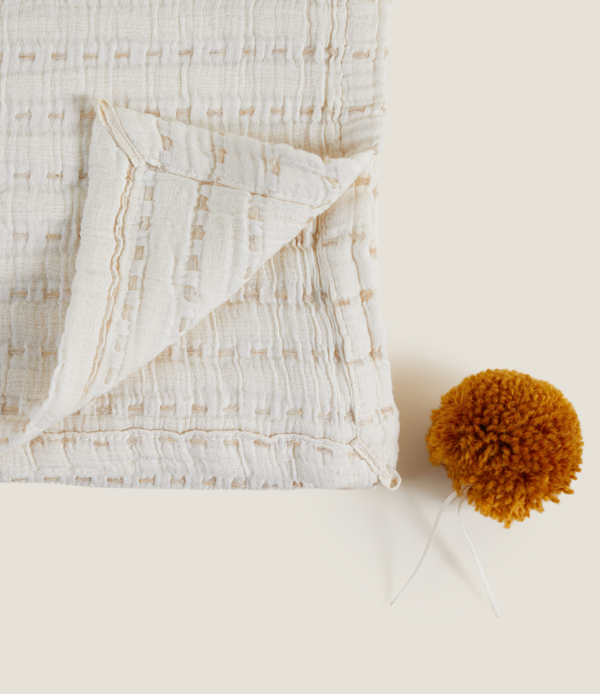 Maison | Swaddle avec Pompons | Brique Mélangé | 78cm x 107cm