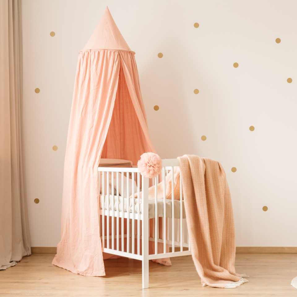 Baby girl nursery decor with delicate and elegant details